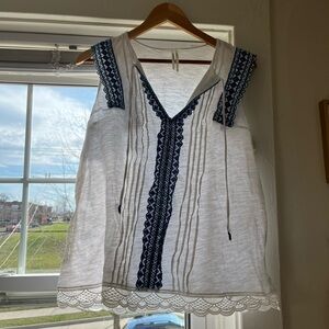 White Sleeveless Embroidered V-Neck Top with Navy Trim